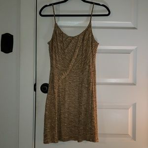 Adorable mini dress with earth toned knit exterior